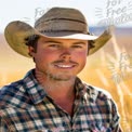 Smiling Young Cowboy in Rustic Landscape - Western Lifestyle and Agriculture