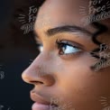 Close-Up of Thoughtful Young Woman's Face with Natural Beauty and Curly Hair