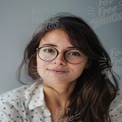 Natural Beauty Portrait of a Young Woman with Glasses and Soft Lighting