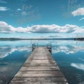 Tranquil Lake Dock Under Blue Sky and Reflections