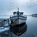 Serene Winter Harbor: Tranquil Fishing Boat Reflected in Calm Waters