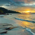 Serene Tropical Sunset Over Tranquil Beach with Wooden Pathway