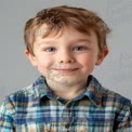 Cheerful Young Boy Portrait with Friendly Smile in Casual Attire