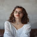 Natural Beauty Portrait of a Young Woman with Glasses in Soft Lighting