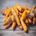 Fresh Turmeric Roots on Rustic Wooden Surface - Natural Health and Culinary Spice