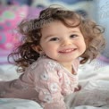 Joyful Toddler with Curly Hair Smiling on Bed - Childhood Happiness and Innocence