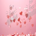 Romantic Heart Confetti on Pink Background for Valentine's Day Celebrations