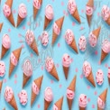 Colorful Ice Cream Cones on Blue Background with Sprinkles - Summer Treats and Desserts