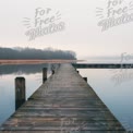 Tranquil Foggy Lake Pier: Serene Water Reflection and Nature Escape