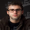 Confident Young Man with Glasses Against Dark Background - Portrait for Business and Personal Brandi