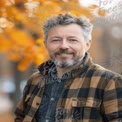 Smiling Man in Autumn Park with Orange Leaves - Warm Outdoor Portrait