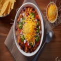 Delicious Vegetarian Chili Bowl with Fresh Toppings and Tortilla Chips