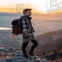 Adventurous Young Man Enjoying Sunset View on Mountain Top