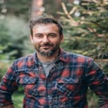 Confident Man in Nature: Outdoor Portrait with Flannel Shirt