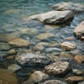 Tranquil River Stones: Natural Water Landscape for Relaxation and Serenity