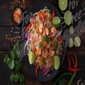 Delicious Shrimp Pad Thai with Fresh Vegetables and Lime Garnish