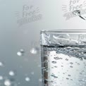 Refreshing Clear Water Splash in Glass - Hydration and Purity Concept