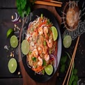 Delicious Shrimp Noodle Salad with Fresh Vegetables and Lime Garnish